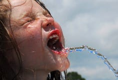 Hot sweaty girl drinking water