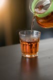 Hot tea rose is poured into a glass stock photography Hot tea rose is poured into a glass stock photography