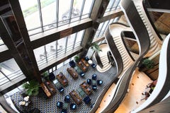 Hotel lobby. A hotel lobby atrium with sofas and tea table Hotel lobby. A hotel lobby atrium with sofas and tea table
