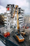 House/ building demolition, excavator machine stock photo House/ building demolition, excavator machine stock photo