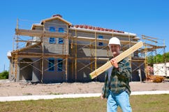 House Construction With A Contractor At Work Stock Photo