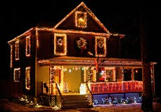 House decorated with Christmas lights at rural neighborhood
