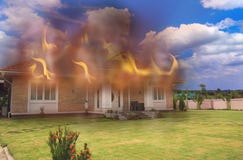 A House On Fire and Burning Down, Putting Out The Flames. royalty free stock photo A House On Fire and Burning Down, Putting Out The Flames. royalty free stock photo