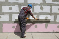 House renovation, polystyrene wall insulation, level tool royalty free stock photo House renovation, polystyrene wall insulation, level tool royalty free stock photo
