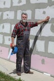 House renovation, polystyrene wall insulation and worker stock image House renovation, polystyrene wall insulation and worker stock image