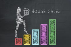 House sales concept. Drawn business woman holding house and climbing up on hand drawn graphs chart diagram columns stock photo House sales concept. Drawn business woman holding house and climbing up on hand drawn graphs chart diagram columns stock photo