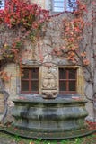 House Wall, Fountain With Colorful Vines And Autumn Leaves Stock Photo House Wall, Fountain With Colorful Vines And Autumn Leaves Stock Photo