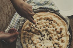 House woman cutting just baked cheesecake. Hand cutting freshly baked cake with cottage cheese royalty free stock photo House woman cutting just baked cheesecake. Hand cutting freshly baked cake with cottage cheese royalty free stock photo