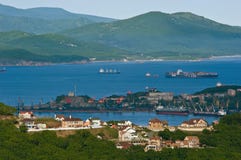 Houses on the background of the port of Nakhodka. Far East of Russia. 11.06.2013 Stock Images Houses on the background of the port of Nakhodka. Far East of Russia. 11.06.2013 Stock Images