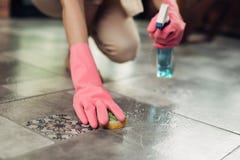 Housework and housekeeping concept. Woman cleaning floor with mo