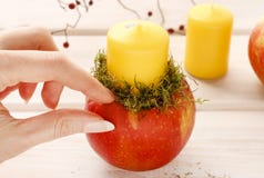 How to make apple and wild rose candle holders Royalty Free Stock Image How to make apple and wild rose candle holders Royalty Free Stock Image