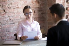HR young manager woman interviewing male in the office stock images HR young manager woman interviewing male in the office stock images