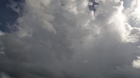 Huge dark storm clouds moving in a time lapse on a summer day