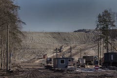 A huge garbage dump.Unloading garbage trucks at the dump royalty free stock photo A huge garbage dump.Unloading garbage trucks at the dump royalty free stock photo