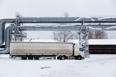 Huge gas pipeline laid along snowy street in Riga, Latvia royalty free stock photo Huge gas pipeline laid along snowy street in Riga, Latvia royalty free stock photo