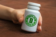 Human hand holding a bottle of pills with vitamin D royalty free stock photos Human hand holding a bottle of pills with vitamin D royalty free stock photos