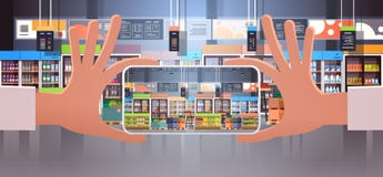 Human hand holding smartphone taking photo modern supermarket interior with grocery food assortment displaying on mobile royalty free illustration Human hand holding smartphone taking photo modern supermarket interior with grocery food assortment displaying on mobile royalty free illustration