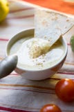 Hummus - traditional lebanese food. Hummus in traditional bowl with tht piece of bread Stock Photos Hummus - traditional lebanese food. Hummus in traditional bowl with tht piece of bread Stock Photos