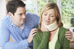 Husband Comforting Wife Suffering With Neck Injury Royalty Free Stock Photo Husband Comforting Wife Suffering With Neck Injury Royalty Free Stock Photo