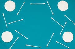 Hygiene products: round white cotton pads and cotton swabs are on colored background stock photography Hygiene products: round white cotton pads and cotton swabs are on colored background stock photography