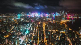 Hyper lapse time-lapse of Hong Kong cityscape, traffic transportation at night, Victoria harbor drone aerial view