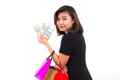 Härlig ung asiatisk kvinna med färgrika shoppingpåsar En han arkivfoto Härlig ung asiatisk kvinna med färgrika shoppingpåsar En han arkivfoto