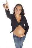 Härlig ung gravid kvinna som pekar något royaltyfri bild Härlig ung gravid kvinna som pekar något royaltyfri bild