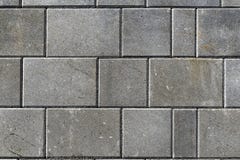 Hårdna eller lappa gråa trottoartjock skiva eller stenar för golv som är wal arkivfoto Hårdna eller lappa gråa trottoartjock skiva eller stenar för golv som är wal arkivfoto