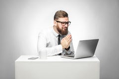 I need your help! Portrait of hopeful bearded young manager in white shirt and black tie are sitting in office and talking with royalty free stock images I need your help! Portrait of hopeful bearded young manager in white shirt and black tie are sitting in office and talking with royalty free stock images