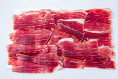 Iberian ham cut on white tray royalty free stock photography Iberian ham cut on white tray royalty free stock photography