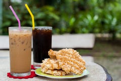 Ice Coffee And Americano With Rice Cracker (Khao Tan) Royalty Free Stock Photos