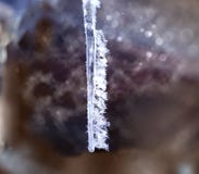 Ice crystals on a hanging icicle