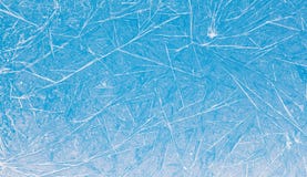 Ice flowers frozen blue window textured background. macro view photography frost pattern. cold winter weather xmas