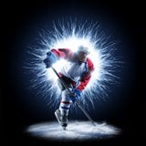 Ice Hockey player is skating on a abstract background stock photos Ice Hockey player is skating on a abstract background stock photos