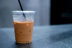 Iced coffee in plastic cup on the relaxing time stock photo Iced coffee in plastic cup on the relaxing time stock photo