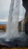 Iceland - Waterfall from behind stock photography Iceland - Waterfall from behind stock photography