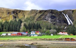 Icelandic Houses And Waterfall Stock Photography
