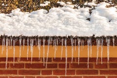 Icicles on a roof of an old dutch farm royalty free stock photos Icicles on a roof of an old dutch farm royalty free stock photos