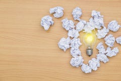 Idea concept incandescent bulb with lighting And crumpled paper stock images Idea concept incandescent bulb with lighting And crumpled paper stock images