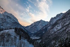 Idyllic alpine snowy mountain view in sunset sky, julian alps, Slovenia Stock Image Idyllic alpine snowy mountain view in sunset sky, julian alps, Slovenia Stock Image