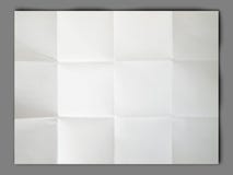 Il Libro Bianco ha piegato e si spiegazzato su priorità bassa grigia fotografia stock Il Libro Bianco ha piegato e si spiegazzato su priorità bassa grigia fotografia stock