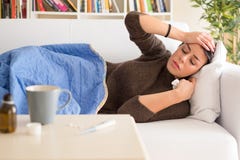 Ill woman portrait on the sofa at home stock image Ill woman portrait on the sofa at home stock image