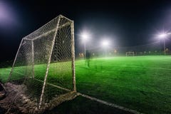 Illuminated football playground with green grass royalty free stock images Illuminated football playground with green grass royalty free stock images
