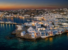 The illuminated town of the island of Mykonos just after summer sunset time Royalty Free Stock Photography The illuminated town of the island of Mykonos just after summer sunset time Royalty Free Stock Photography