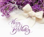Illustration of bouquet from lilac lilies with text Happy Birthday. Calligraphy lettering