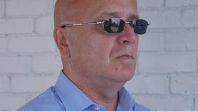 Image with a Confident Businessman Wearing Sunglasses stock photo Image with a Confident Businessman Wearing Sunglasses stock photo