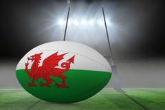 Imagem composta da bola de rugby da bandeira de galês ilustração royalty free Imagem composta da bola de rugby da bandeira de galês ilustração royalty free