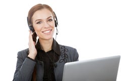 Imagem do operador fêmea de sorriso da linha aberta com fones de ouvido e fotografia de stock Imagem do operador fêmea de sorriso da linha aberta com fones de ouvido e fotografia de stock