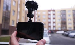 A device for monitoring the situation on the road. Installed in the car. Details and close-up royalty free stock photography A device for monitoring the situation on the road. Installed in the car. Details and close-up royalty free stock photography