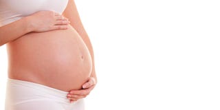Immagine della donna incinta che tocca la sua grande pancia Fine in su Maternit?, gravidanza, la gente e concetto di aspettativa fotografia stock Immagine della donna incinta che tocca la sua grande pancia Fine in su Maternit?, gravidanza, la gente e concetto di aspettativa fotografia stock